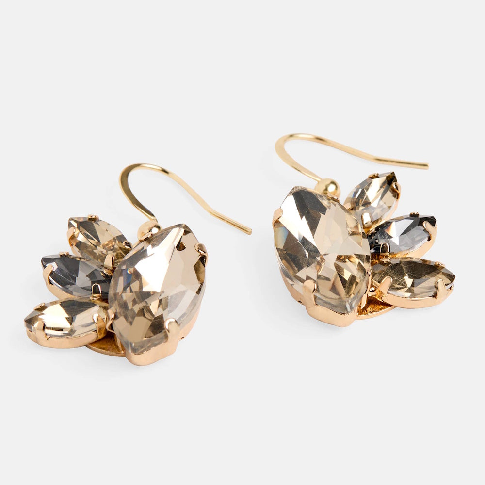 Gold dangle earrings with a burst design of topaz and smokey quartz marquise-cut crystals in a prong setting.