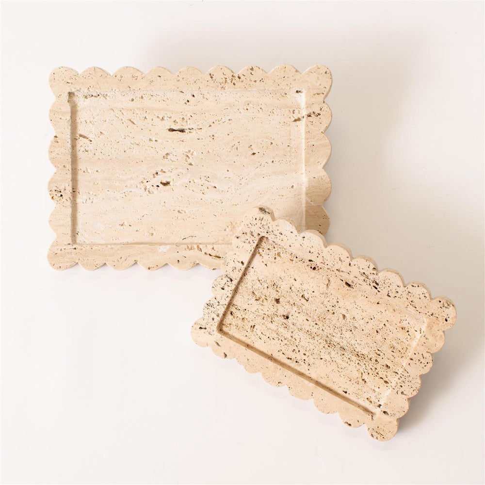 Two scalloped edge rectangular travertine stone trays in beige with natural pitted textures on a white background.