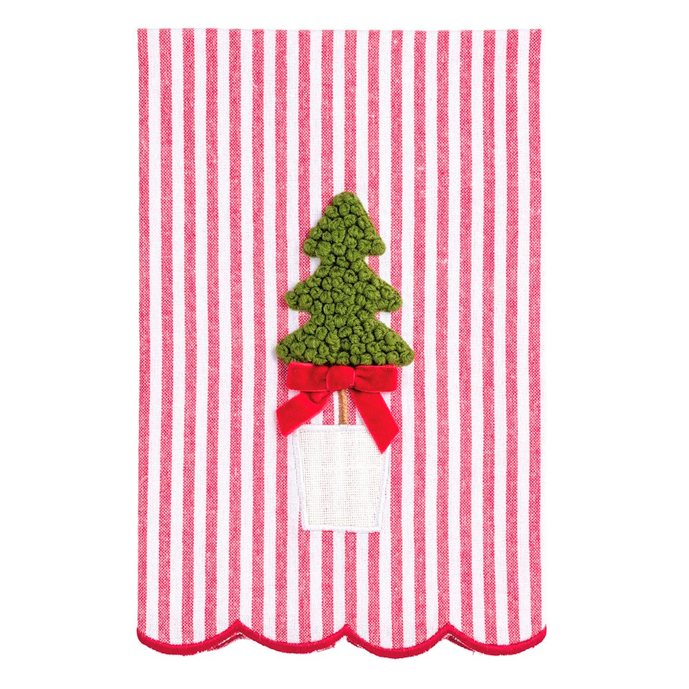 White towel with red vertical stripes and an embroidered green Christmas tree tied with a red bow.