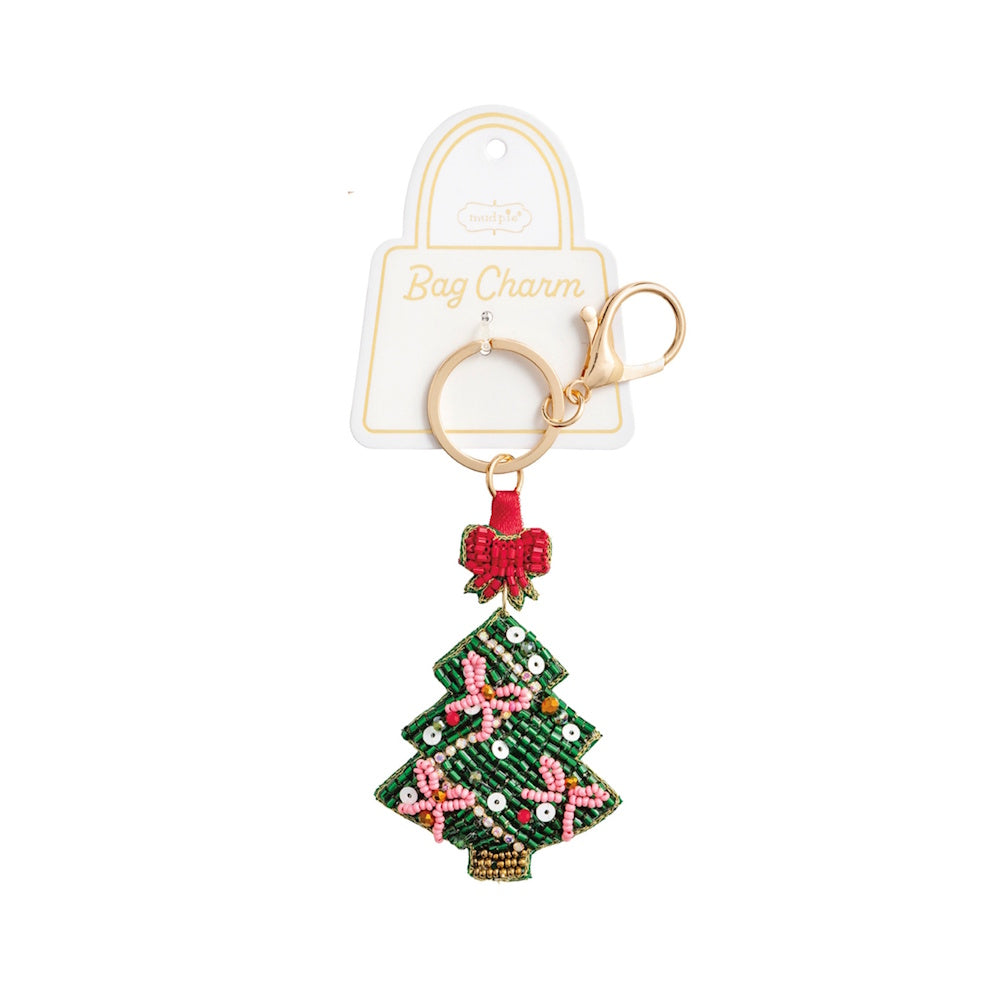 Beaded green Christmas tree bag charm topped with a red bow and gold keychain hardware.
