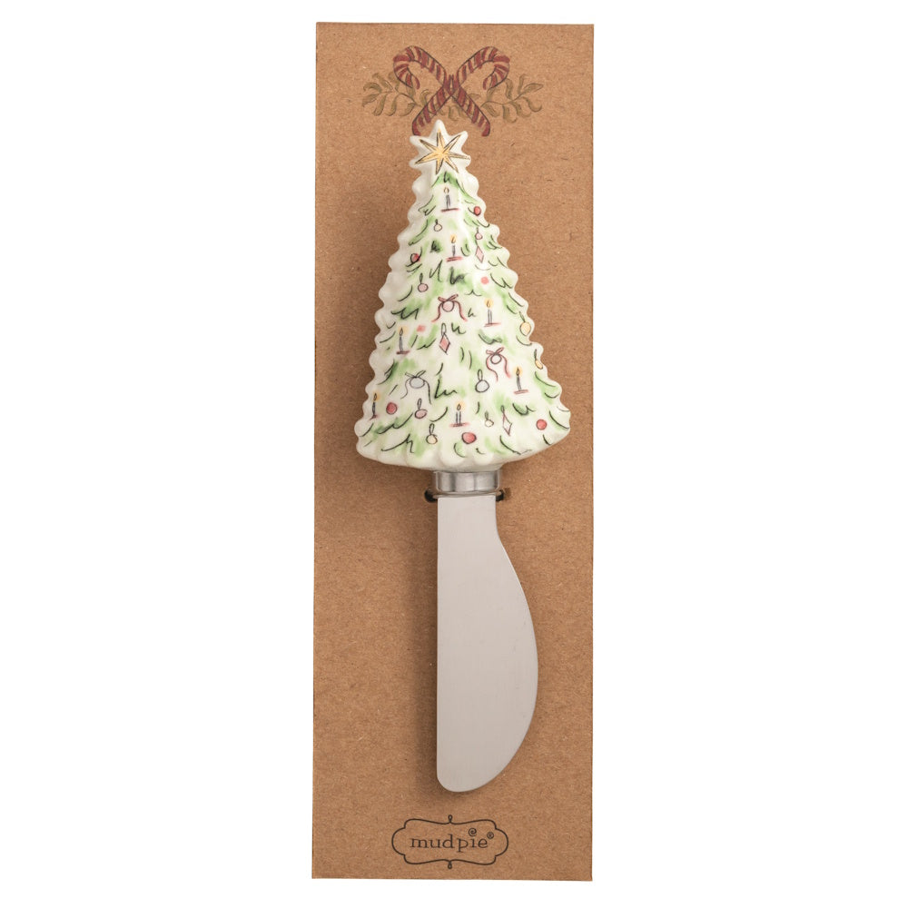Christmas tree spreader with a decorated tree handle and metal blade on packaging.