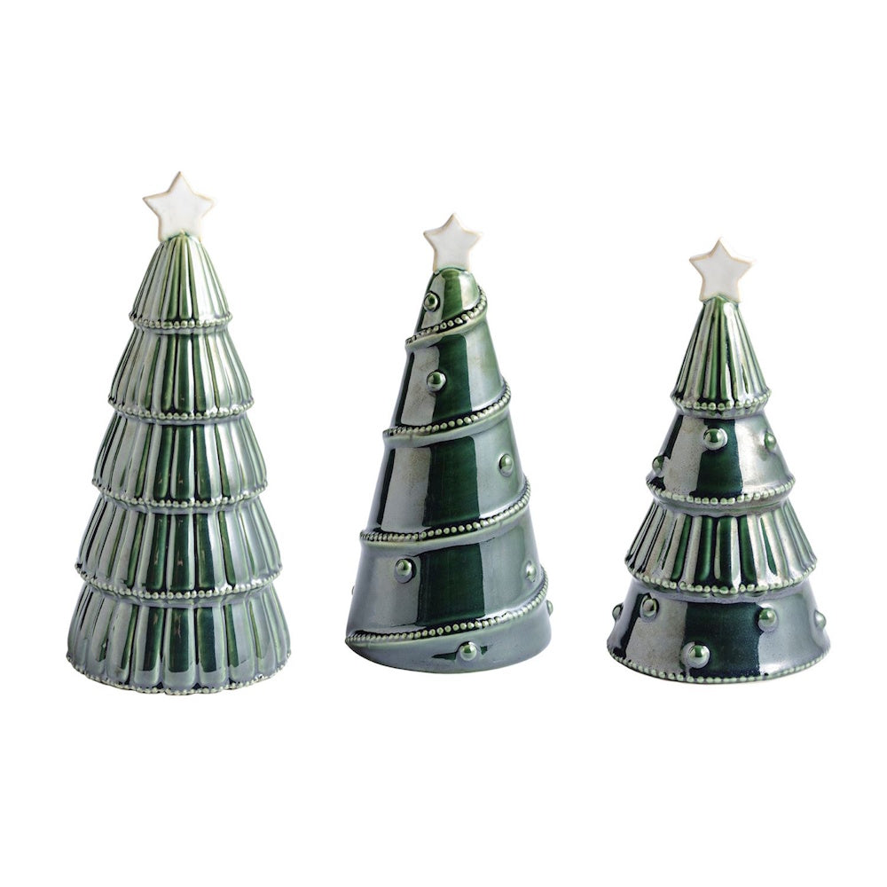 Set of three green ceramic Christmas tree tabletop figurines topped with white stars.
