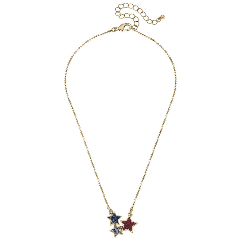 Gold-tone ball chain necklace with three small glittery star charms in blue, silver, and red.