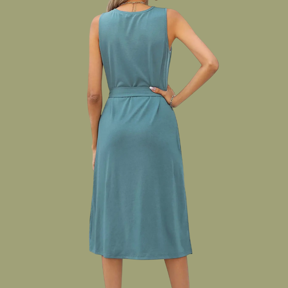 Back view of a woman wearing a sleeveless, belted, turquoise midi T-shirt dress against a solid background.