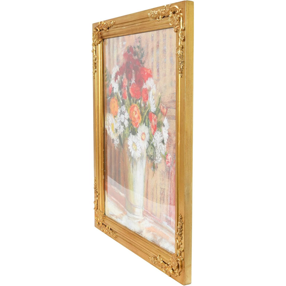 A side view of a vintage floral still life painting in an ornate, gold-finished solid wood frame with decorative carvings.