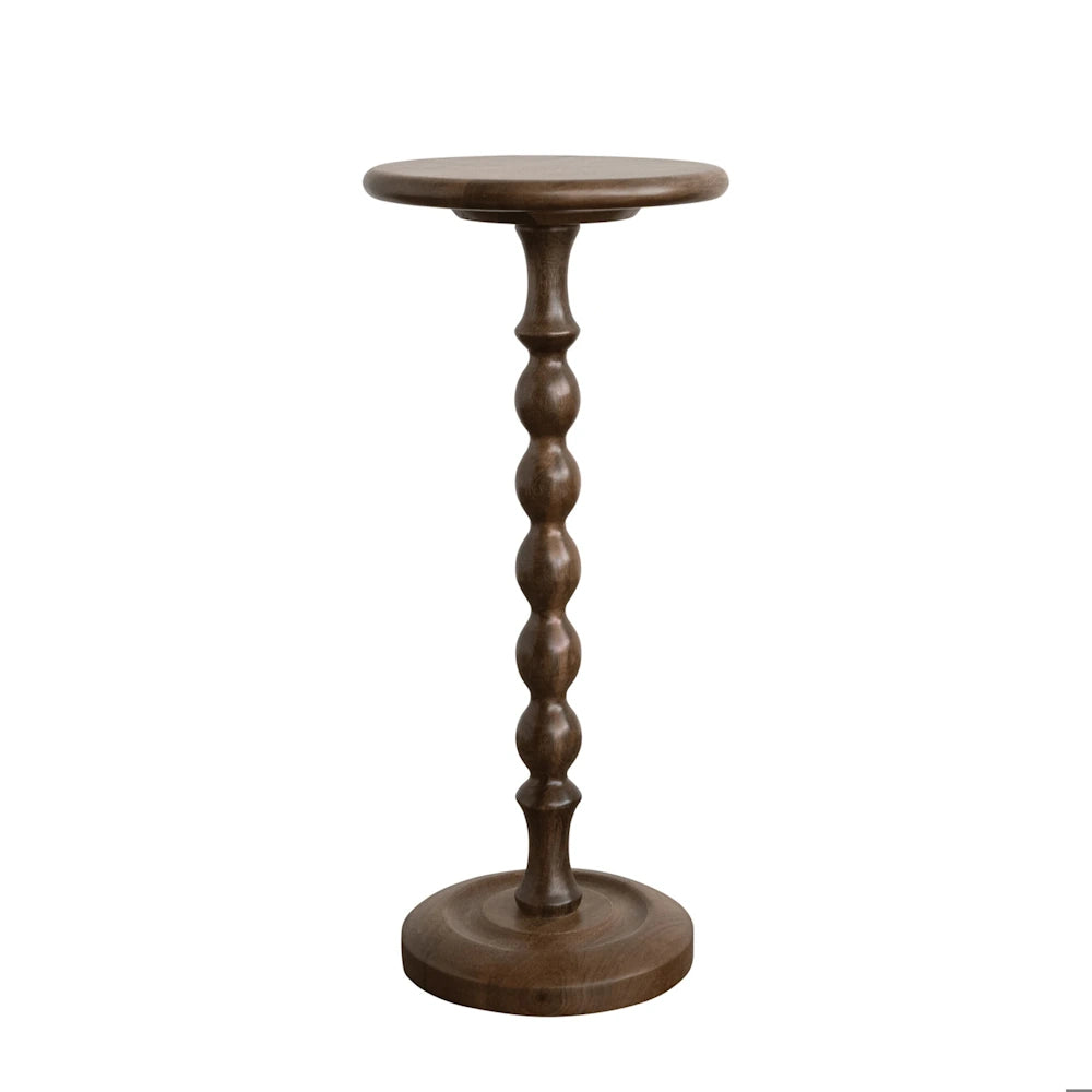 Tall dark wood martini table featuring a round top, a decorative turned-bead pedestal stem, and a sturdy round base.