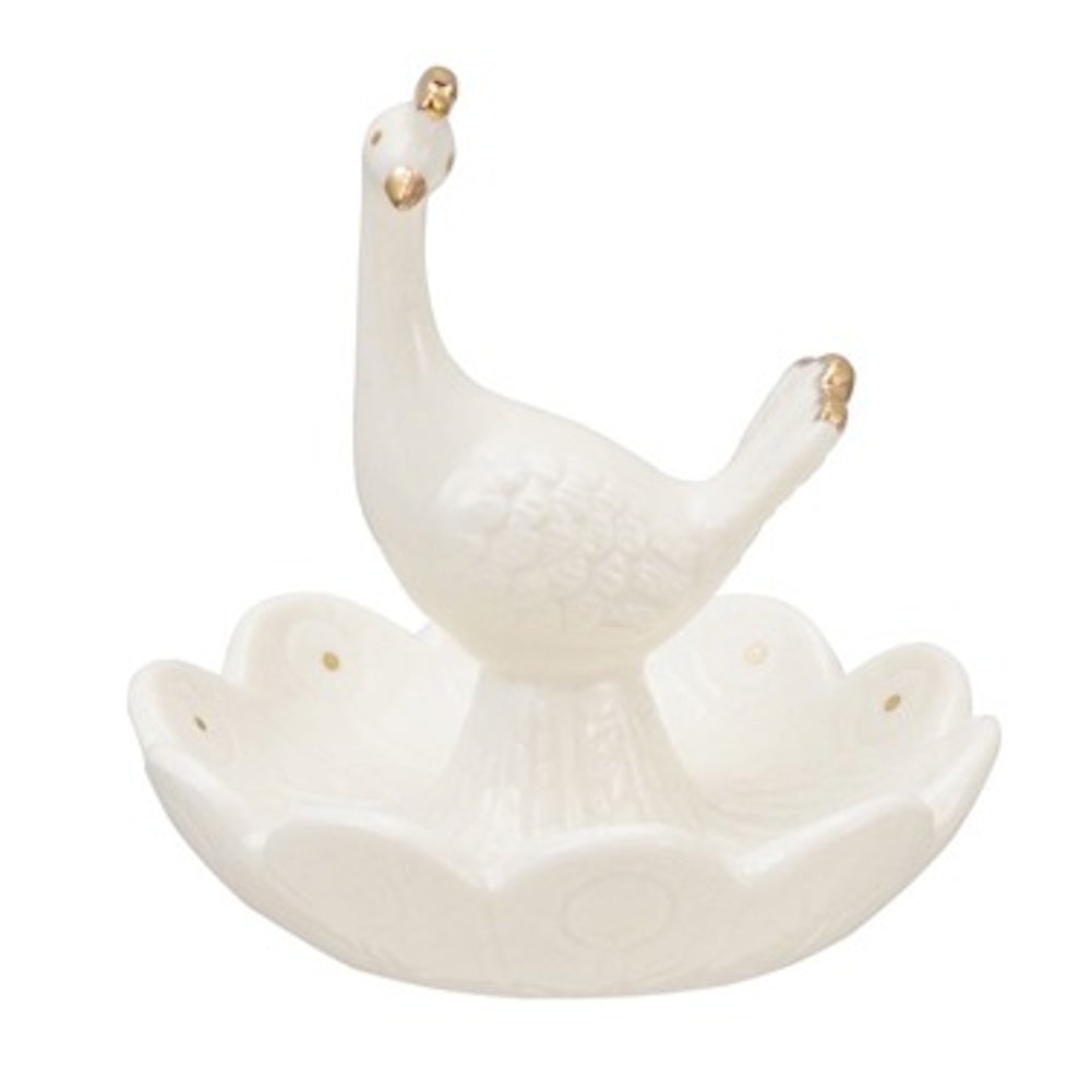 White embossed stoneware ring dish featuring a central peacock figurine with gold-tipped accents on a scalloped base.