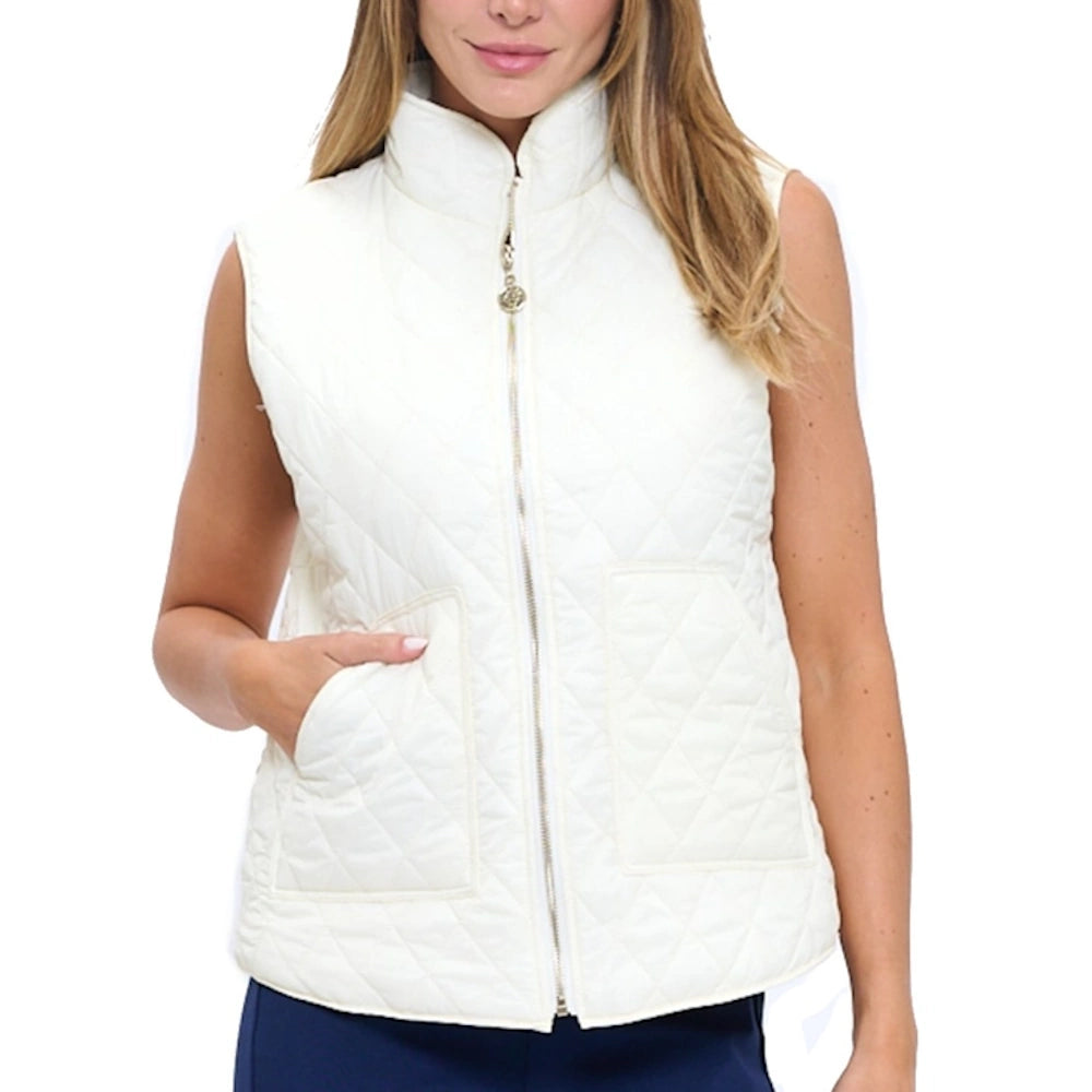 Woman wearing a white quilted zip-up vest with front pockets over a navy top.