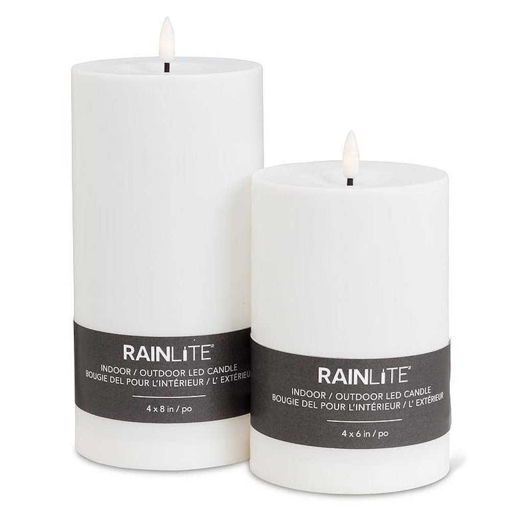 Pair of white, battery-operated indoor/outdoor pillar candles in two different sizes.