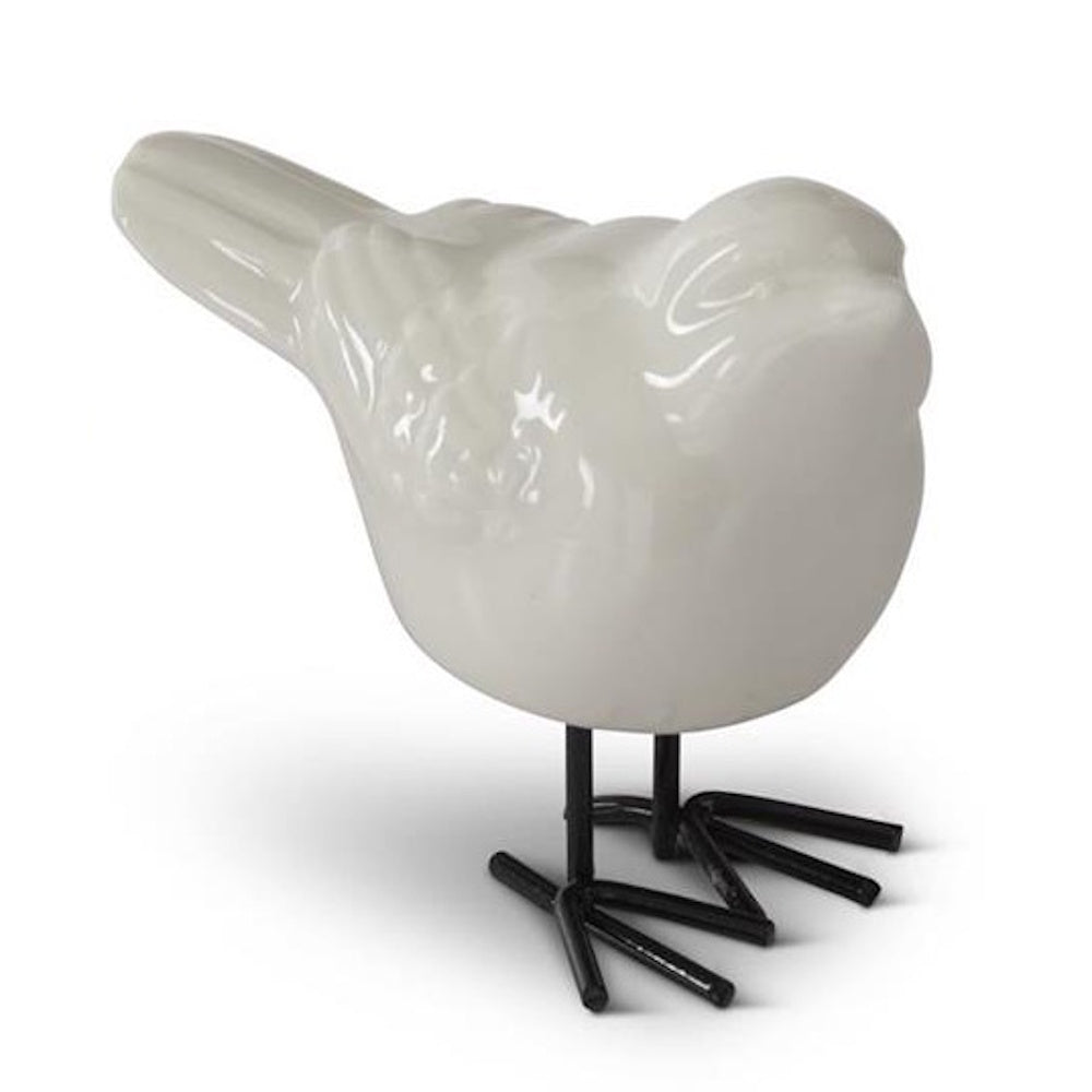 White porcelain bird figurine with a glossy finish and black metal legs, isolated on a white background.