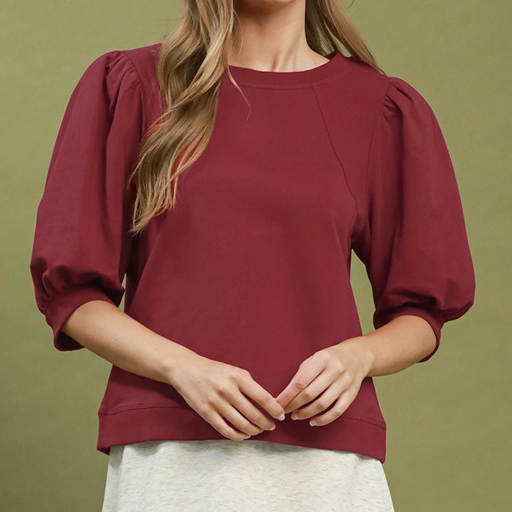 Wine red crewneck pullover sweatshirt featuring dramatic elbow-length puff sleeves.