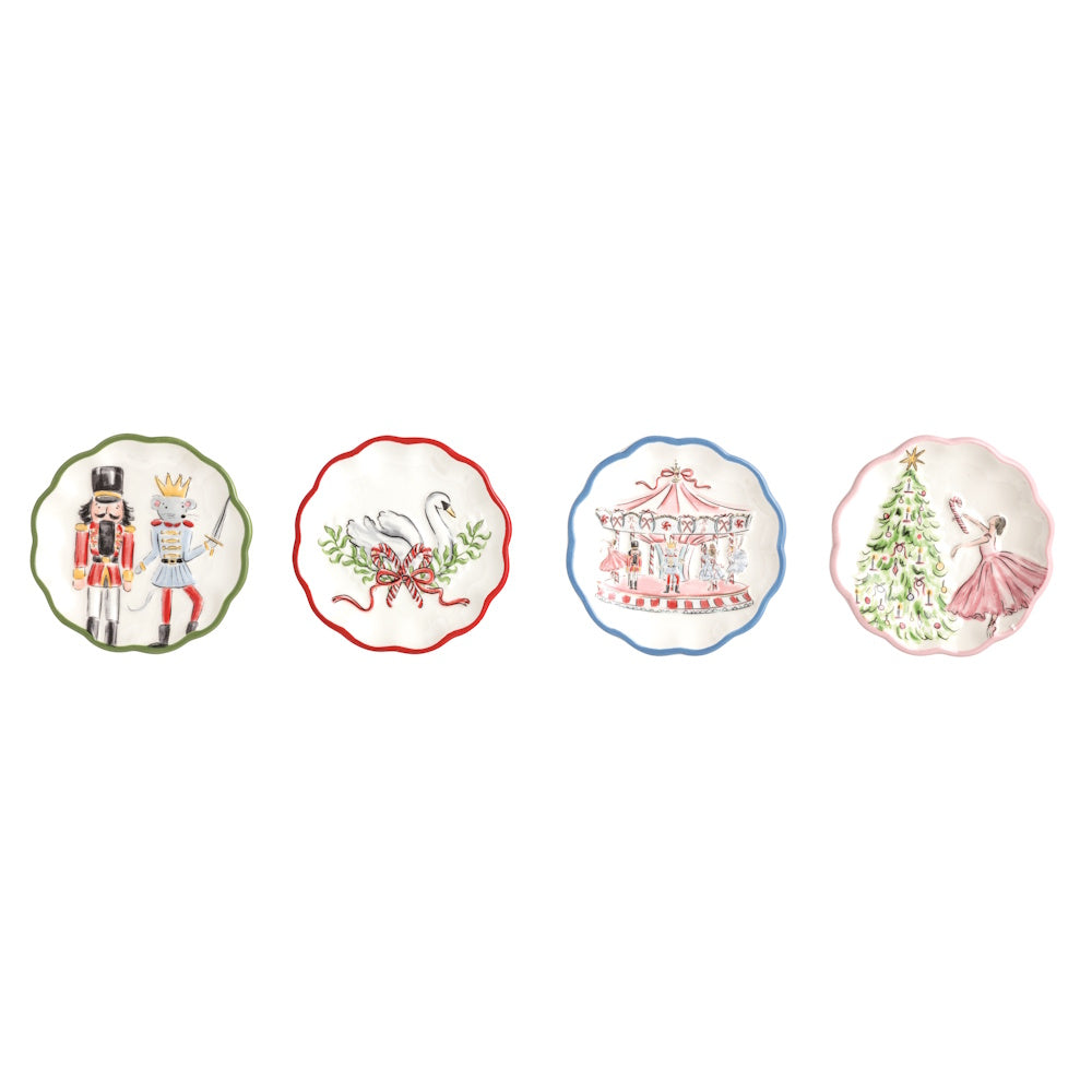 Set of four winter wonderland scalloped tidbit plates featuring holiday themes like a nutcracker, swan, carousel, and tree.