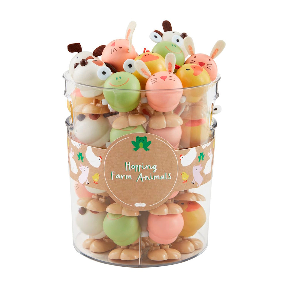 Clear container of wooden hopping farm animal wind-up toys including a bunny, frog, and chick.