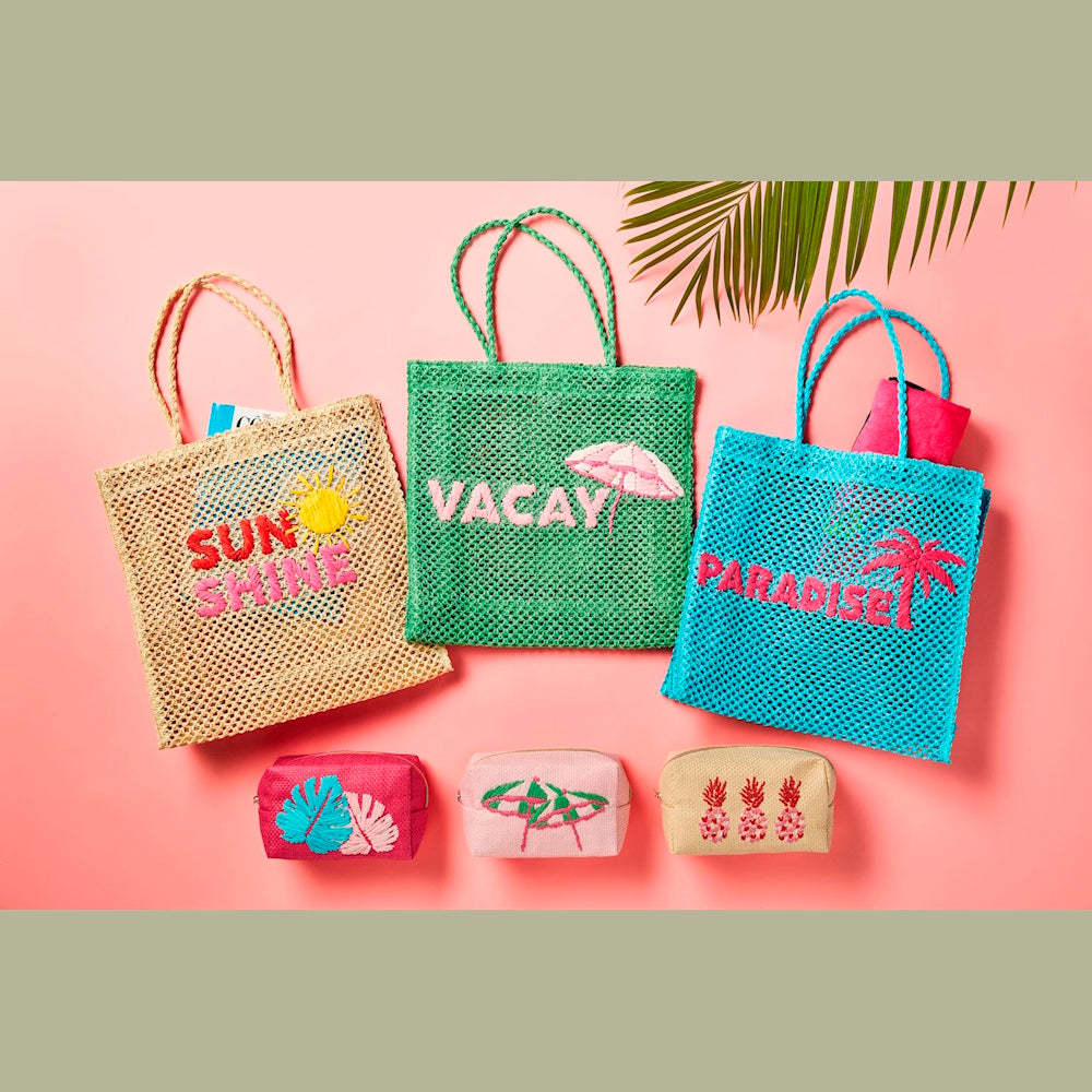 Three woven mesh tote bags and matching small pouches with embroidered tropical words and designs on pink background.