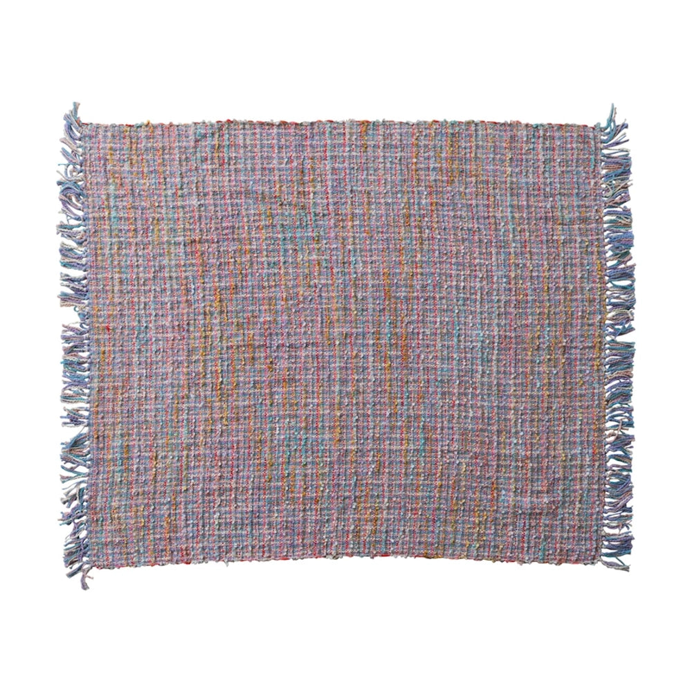 Colorful woven textured place mat with fringed edges, featuring pink, blue, and yellow threads on a white background.