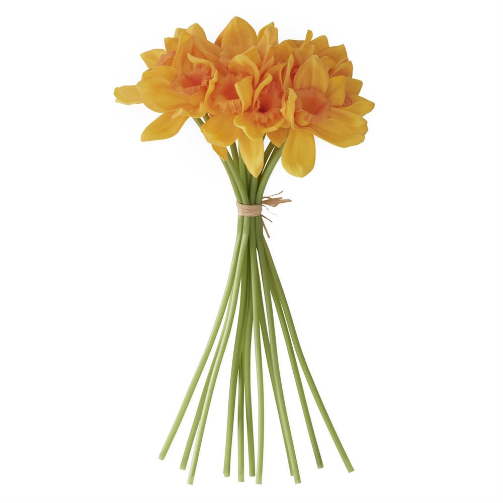 Bundle of yellow artificial daffodils with green stems tied with twine on a white background.